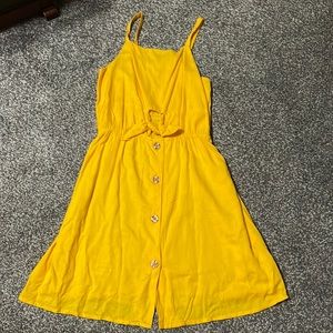 Girls yellow sundress.  Cutout detail in front.